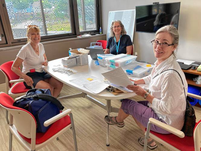 Cooperative Public Health Service public health nurses Lisa White (right), Meg Ryan (center) and nurse Jackie Choate (left) prepare to provide home vaccination visits in the fall of 2022.