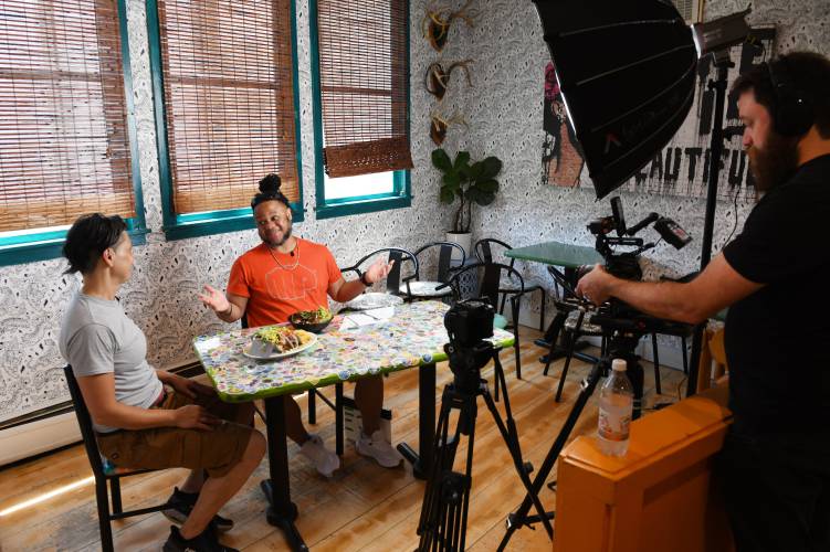 Mesa Verde owner Amy McMahan is interviewed by Theo Williams of “America’s Best Restaurants” as videographer Jon Van Dyke records the scene in the Greenfield restaurant on June 18. The episode was recently posted on YouTube.