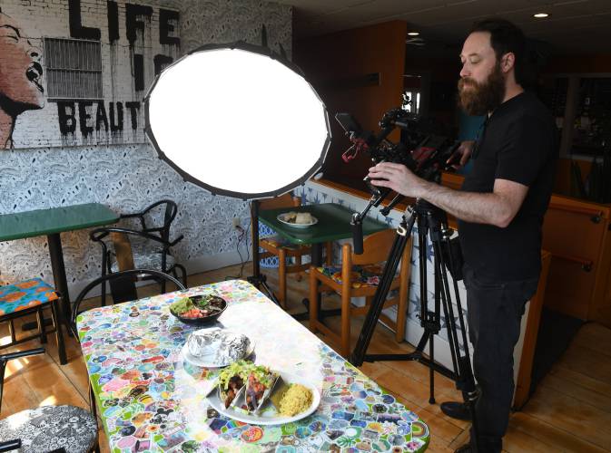 Videographer Jon Van Dyke of “America’s Best Restaurants” films entrees at Mesa Verde in Greenfield on June 18. The episode was recently posted on YouTube.