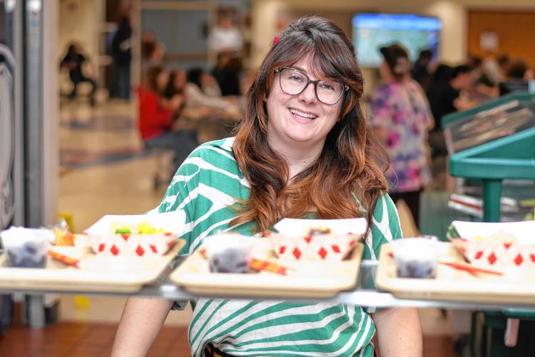 Katrina Bressani, the new food service director for the Ralph C. Mahar Regional and Union 73 school districts, with poke bowls in the Mahar cafeteria in Orange.