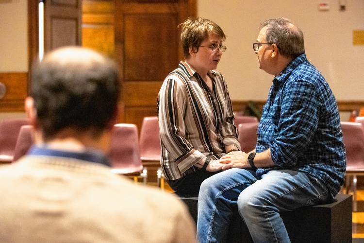 Director Matteo Pangallo looks on as Sam Fox and Jim Merlin rehearse Valley Players’ production of “Constellations” at Munson Memorial Library in Amherst.