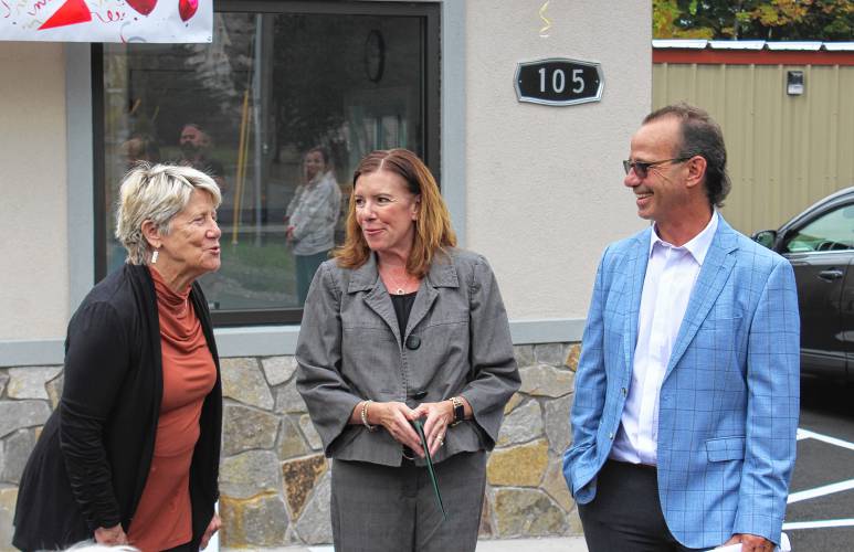 Greenfield Mayor Ginny Desorgher, left, talks with Premier Self Storage owners Ellen and Jim Boyle at a ribbon-cutting ceremony at 105 Newton St. last week.