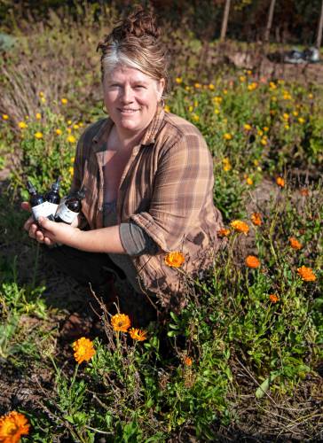 Anne Wagner, owner of Blue Crow Botanicals, in her gardens in Greenfield.