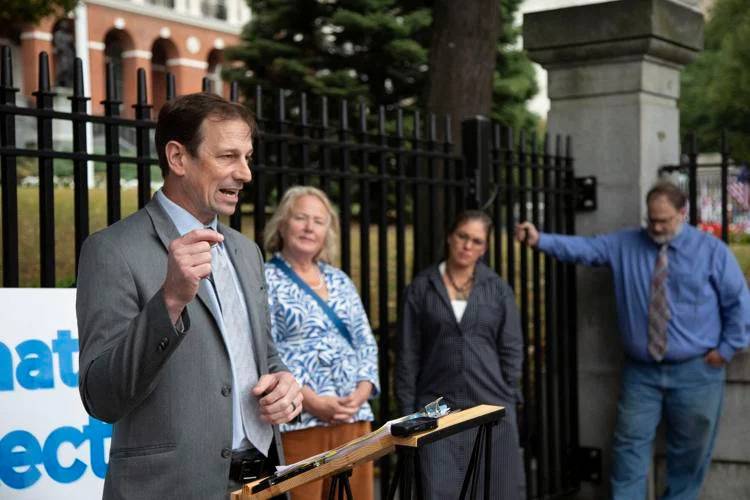 Toby Leary, a co-owner of Cape Gun Works in Hyannis and chair of the Civil Rights Coalition working to repeal a gun law Gov. Maura Healey signed in July, speaks with reporters outside the State House on Sept. 19.