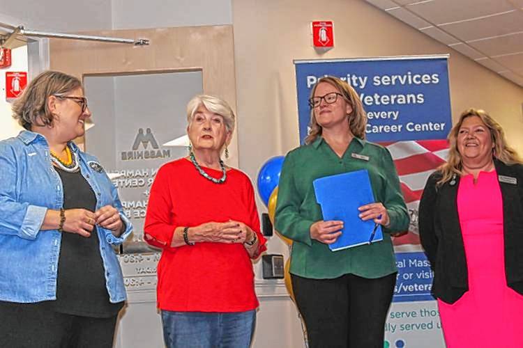 Rebecca Bialecki, far right, then the executive director of the MassHire Franklin Hampshire Workforce Board, and MassHire Franklin Hampshire Career Center Executive Director Maura Geary, second from right, listen to then-Greenfield Mayor Roxann Wedegartner, second from left, speak at a grand opening at 101 Munson St. in Greenfield in September 2023 as Northampton Mayor Gina-Louise Sciarra stands at far left.