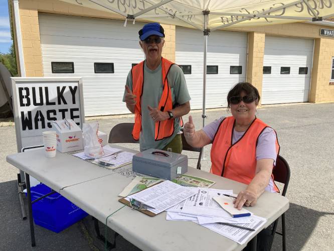 Volunteers Fran Fortino and Linda Talbot staff the check-in table at a previous “Clean Sweep” Bulky Waste Recycling Day in Whately.