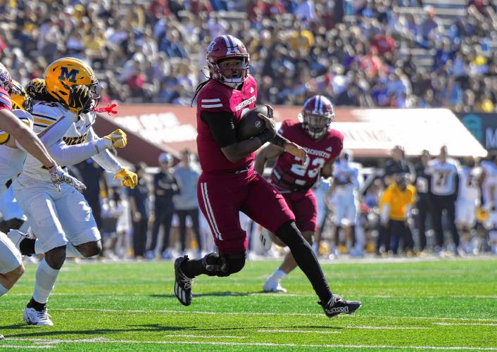 UMass quarterback Taisun Phommachanh carries the ball against Missouri earlier this season. The sixth-year quarterback is out for the season after suffering an injury against Mississippi State, according to head coach Don Brown.