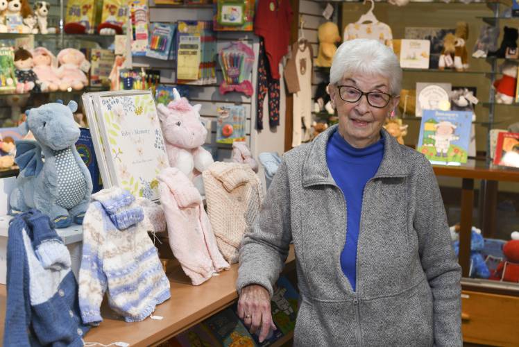 Westfield resident June Burns, 92, knits baby sweaters and matching hats that Baystate Franklin Medical Center sells in its gift shop in Greenfield.