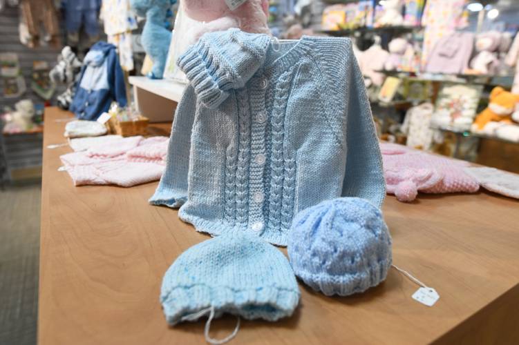 One of the baby sweater sets that was knitted by 92-year-old Westfield resident June Burns, available at the Baystate Franklin Medical Center gift shop in Greenfield.