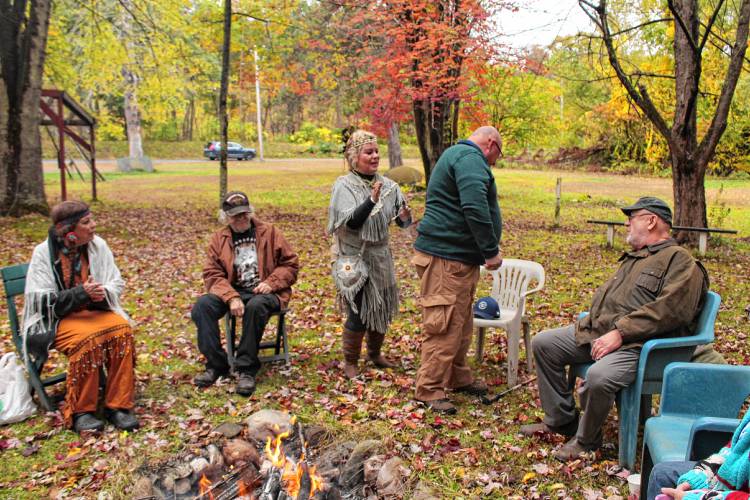 Theresa “Star” Stewart offers cleansing with sage during a brief ceremony on Sunday to recognize the land at 1475 Mohawk Trail (Route 2) in Charlemont. The property was the site of Native American powwows for decades.