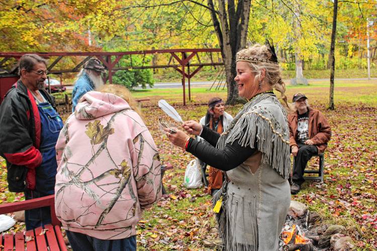 Theresa “Star” Stewart offers cleansing with sage during a brief ceremony on Sunday to recognize the land at 1475 Mohawk Trail (Route 2) in Charlemont. The property was the site of Native American powwows for decades.