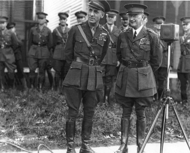 Major Gen. Smedley Butler, left, with Major Gen. Wendell Neville, reviews a Marines parade at Quantico, Virginia on Oct. 31, 1929.