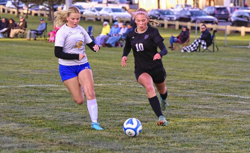 Pioneer’s Maddie Keefe (right) dribbles down the left sideline past Gateway defender Grace Renauld (left) during the first half of the Panthers’ 6-0 win on Thursday afternoon in Northfield.