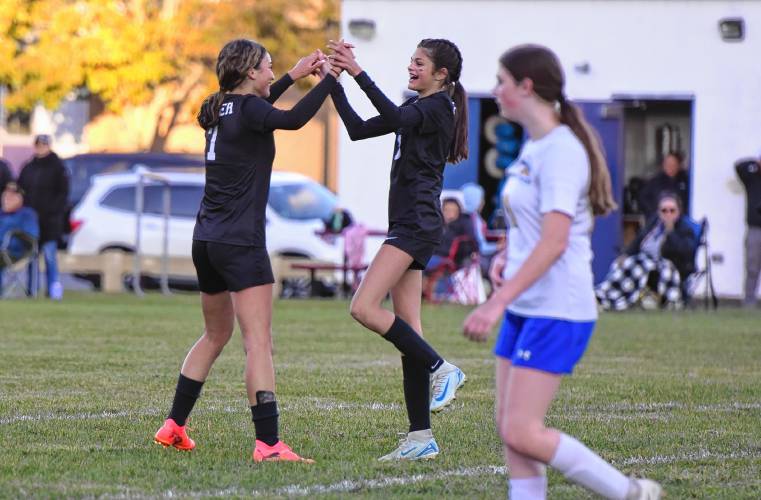 Pioneer’s Natalie Rios (left) and Charley Harrington (right) celebrate following Rios’ goal in the first half of the Panthers’ 00-00 win over Gateway on Thursday afternoon in Northfield.