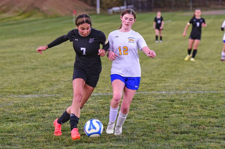 Pioneer’s Natalie Rios (4) looks to cross the ball while being defended by Gateway’s Bella Moulton (12) during the first half of the Panthers’ 00-00 win over Gateway on Thursday afternoon in Northfield.