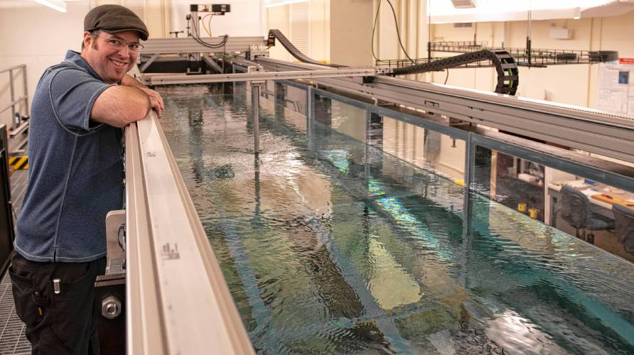 Dana Parsons, the lab manager for mechanical and industrial engineering for the Ocean Resources and Renewable Energy initiative, explains a wave/current flume testing facility that allows researchers to explore wind, wave and tidal energy. The ORRE group is part of the university’s overall renewable energy initiative.