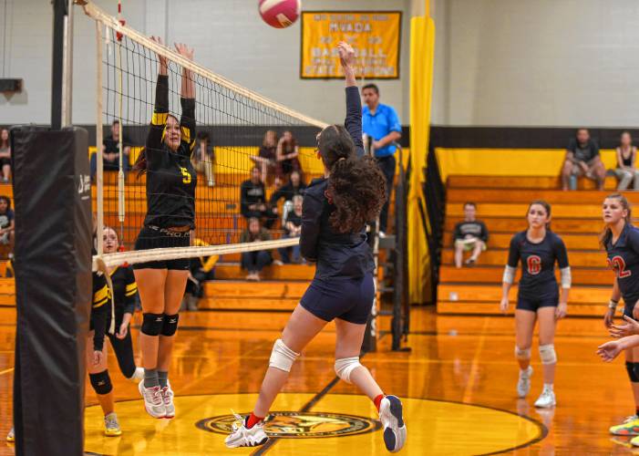 Mahar’s Mia Santana (12) rises for a hit against Smith Vocational during the Senators’ 3-2 win in the Western Mass. Class C quarterfinals on Tuesday in Northampton.