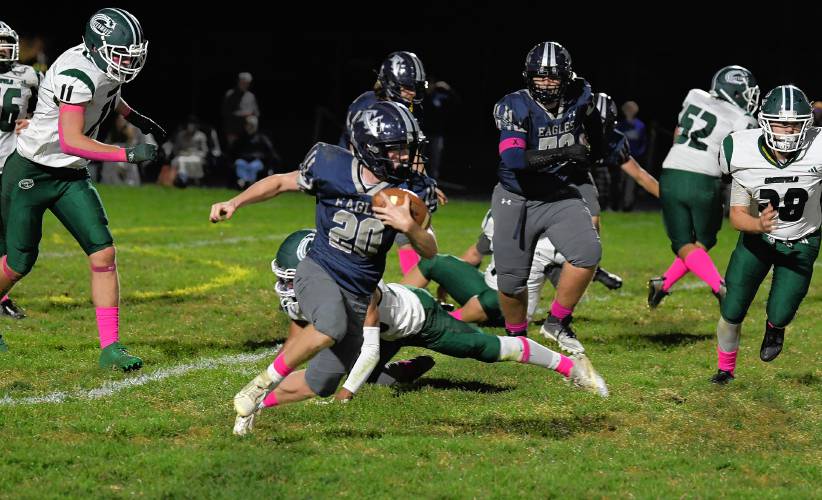 Franklin Tech’s Josiah Little runs the ball against Greenfield last Friday in Turners Falls. The senior running back went over the 1,000 yard mark for the fourth consecutive season in the Eagles’ victory. 