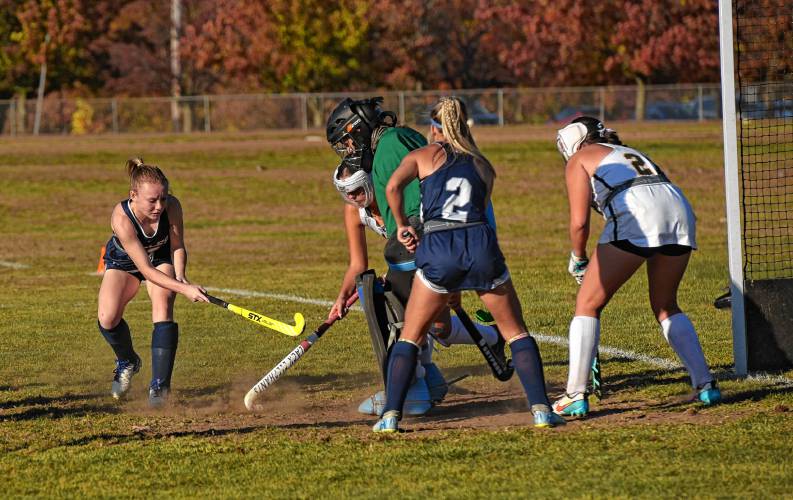 Franklin Tech’s Mckenzie Sourdiffe-Phelps, left, and Abi Dobias (2) try and get the ball past Southwick goalie Ava Lightcap during the visiting Eagles’ 4-0 loss in the Western Mass. Class B semifinals on Wednesday in Southwick.