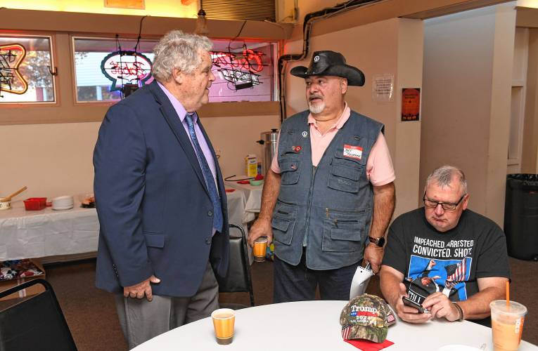 Cornelius Shea, a Shrewsbury conservative running as an Independent to unseat Democratic U.S. Rep. Jim McGovern, and Jeffrey Raymond, a Republican running to unseat state Rep. Susannah Whipps, at a meet-the-candidates event at the Orange American Legion on Tuesday. At right is Christopher J. Ryan.