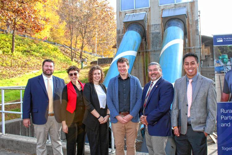 Representatives for the town of Montague, U.S. Sen. Ed Markey’s office, U.S. Rep. Jim McGovern’s office and the U.S. Department of Agriculture pose with the screw pumps at the Montague Clean Water Facility on Wednesday.