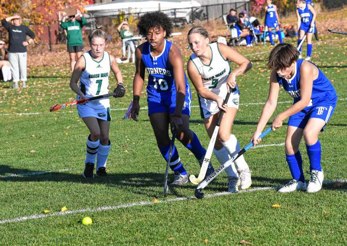 Greenfield’s Riley Thayer (7) and and Sofia Ruggeri chase the ball with Turners Falls’ Khalifa Sack (10) and Niki Nelson in Greenfield on Thursday. 