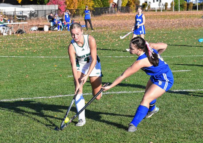 Greenfield’s Henley Gilstrap and Turners Falls’ Ella Guidaboni battle in Greenfield on Thursday. 