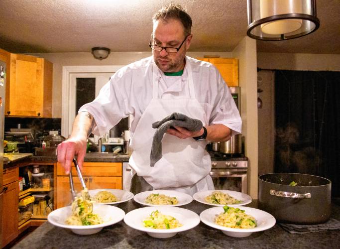 Chef Matthew Brehm plates a course of handmade fresh stringozzi pasta with chard broccolini, Fresno chili pepper, fried shallots, and Parmesan “canna-butter.”