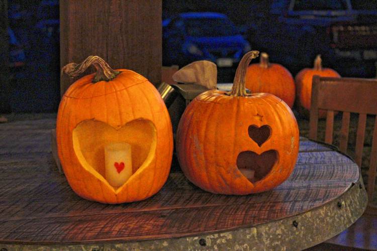 A couple of the carved pumpkins are displayed. Friends and family members gathered to carve pumpkins in memory of Summer Steele on Thursday in Shelburne Falls.