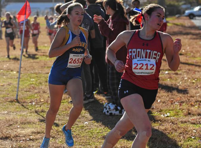 Frontier’s Sylvie DiBartolomeo, right, and Mohawk Trail’s Virginia Krezmien move through the course in the girls race at the Western Mass. Class B Cross Country Championships on Sunday at Stanley Park in Westfield.