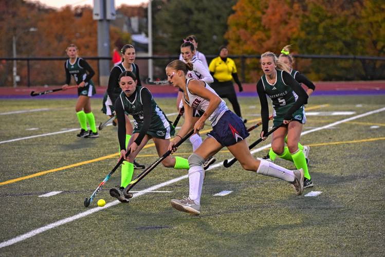 Frontier’s Macy DeMaio (1), right, carries the ball under pressure from Greenfield’s Sofia Ruggeri (9) during the Redhawks’ 2-0 victory over Greenfield in the Western Mass. Class C final on Monday night in Holyoke.