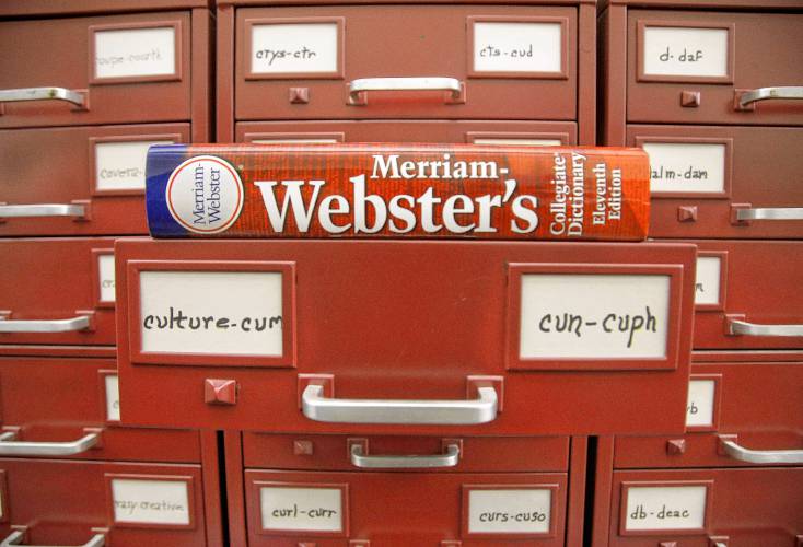 A Merriam-Webster dictionary sits atop citation files at the company’s offices in Springfield. The AP Stylebook replaced Webster’s New World College Dictionary this past May as its primary dictionary with Merriam-Webster, considered a more permissive dictionary.