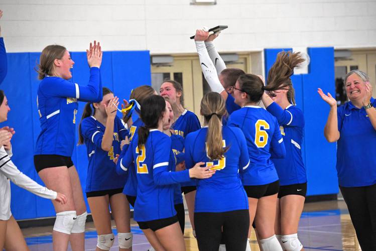 The Mohawk Trail volleyball team celebrates after winning the Western Mass. Class D championship over Lee at West Springfield High School Saturday. 