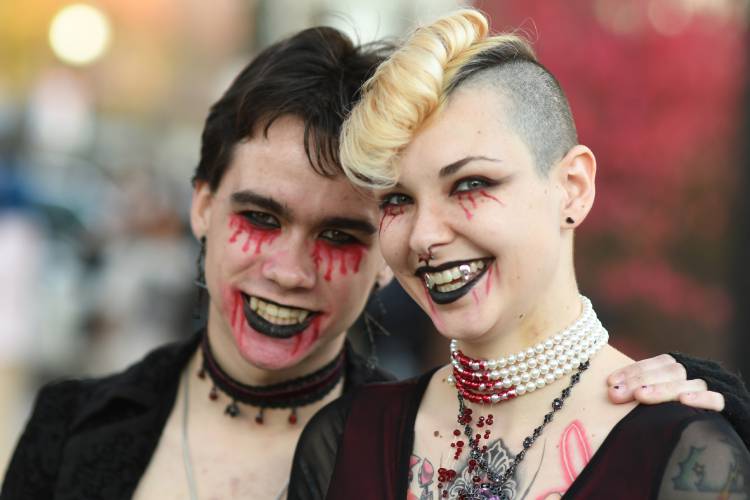 Vampires Max Tomczak and Kya Ransom of Greenfield trick-or-treating in Greenfield.