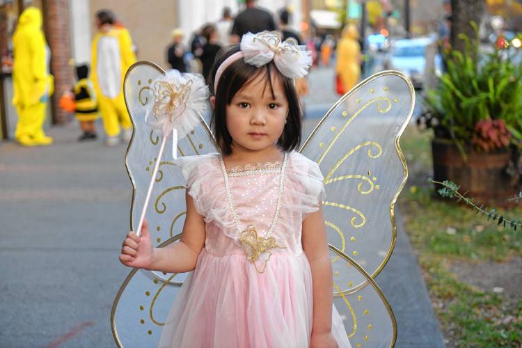 Mina Chi, 5, of Greenfield, is a butterfly trick-or-treating in Greenfield.