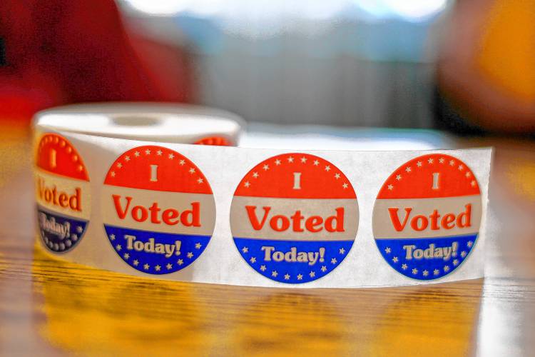 Voting stickers are displayed Sept. 8 at the Bangs Community Center in Amherst during the state primary election. SARAH CROSBY/Gazette Staff