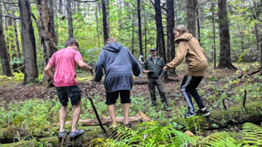 Mohawk Trail climate resiliency students enjoy a hike with Chris Skelly of Buckland Trails.