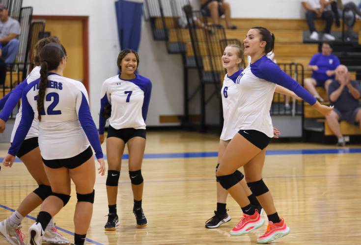 Turners Falls players celebrate an ace by Madi Liimatainen against Easthampton in the first set earlier this season in Turners Falls.