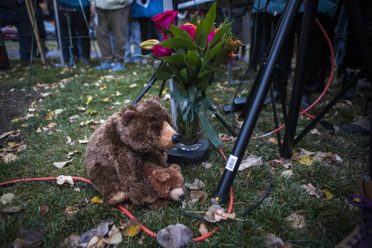 Teddy bears and flowers decorate a candlelight vigil in Jackson, Wyo., Saturday, Nov. 2, 2024.