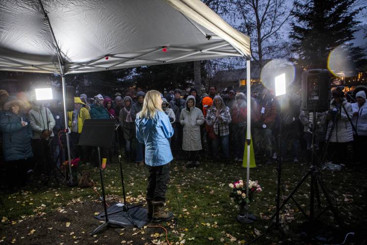 Speaker Tiffany Talbott addresses the crowd about the life and loss of grizzly bear No. 399 at a candlelight vigil in Jackson, Wyo., Saturday, Nov. 2, 2024.