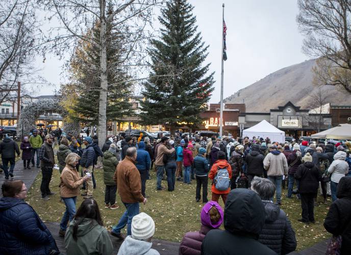 Mourners gather to celebrate the life of grizzly bear No. 399 at a candlelight vigil in Jackson, Wyo. on Nov. 2, 2024.