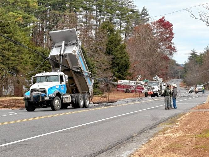 A portion of Route 10 in Bernardston was closed on Monday after a dump truck took down a utility line.