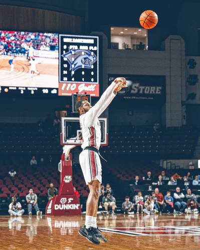 UMass’ Rahsool Diggins shoots the ball against UNH during the Minutemen’s season opener at the Mullins Center in Amherst on Monday night.