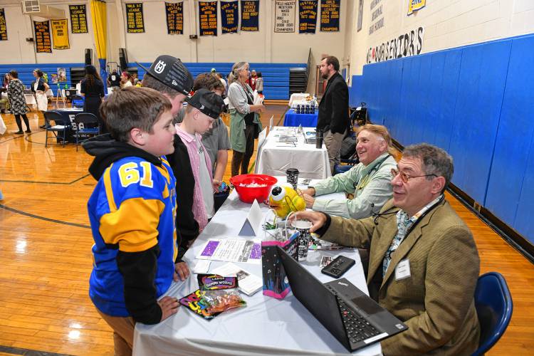 Summer Silverman and Stefan Topolski of Trailside Health in Shelburne Falls talk with students at the West County Community Resource Fair at the Mohawk Trail Regional School.