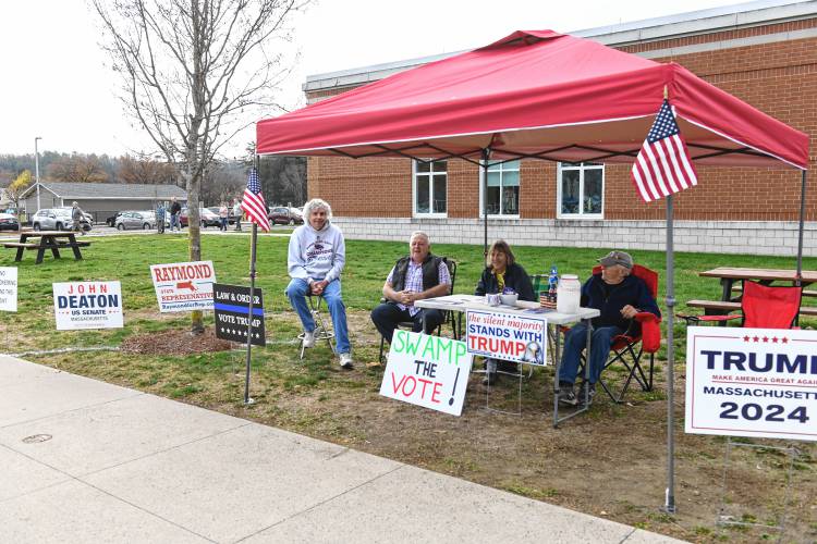 Republicans greet voters at Greenfield High School on Tuesday. 