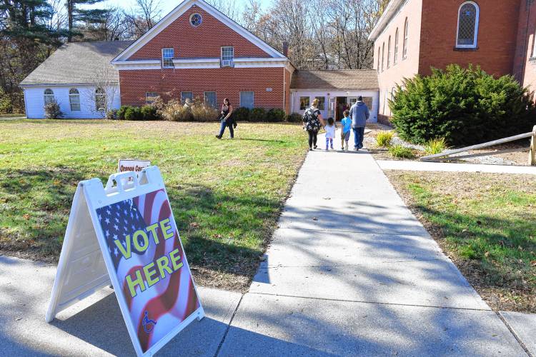 People in Orange vote at the Town Offices on Cheney Street on Tuesday.  