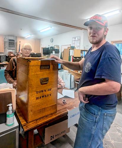 Hawley voter Jeff Hoyt casts his ballot on Tuesday. In the background is poll worker Christine Hicks.