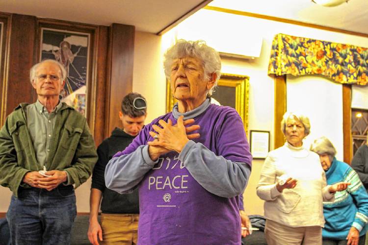 Greenfield resident Sandra Boston leads a prayer during a pre-election gathering organized by the Interfaith Council of Franklin County at the Episcopal Church of Saints James and Andrew in Greenfield on Monday.