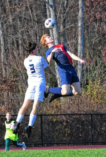 Frontier’s Will Reading heads the ball over  Nantucket’s Ryan Coleman during an MIAA Div. 4 Round of 32 contest in South Deerfield Tuesday. 