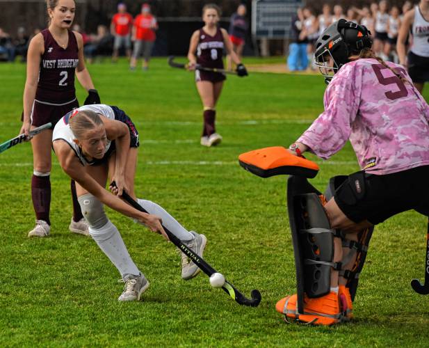 Frontier’s Macy DeMaio (1) tries to sneak a shot past West Bridgewater goalie Allie Edgerly during the Redhawks’ 5-0 win in the MIAA Division 4 Round of 16 on Wednesday in South Deerfield.